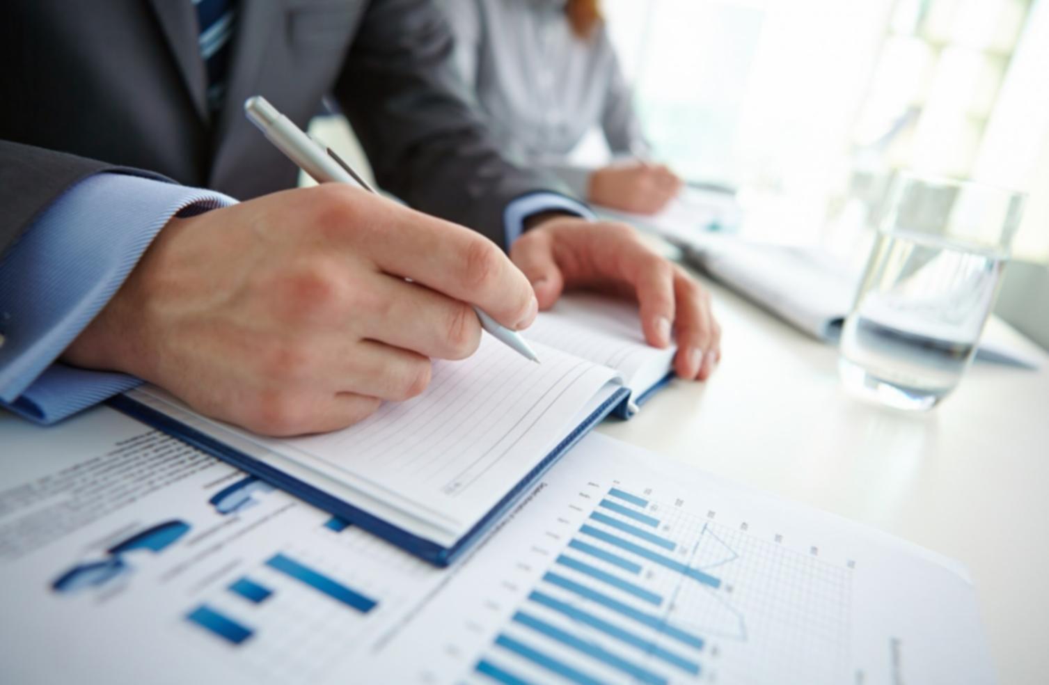 Business team reviewing financial data and budget reports